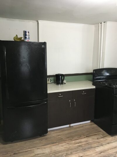 Kitchen fridge, counter, stove